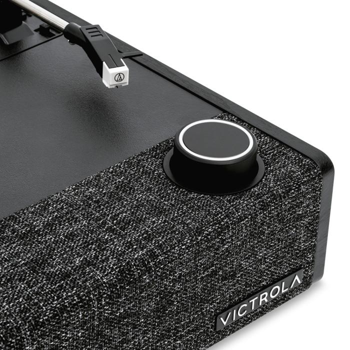 Close-up of a modern turntable with speaker.