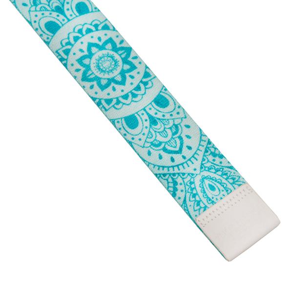 Turquoise mandala-pattern yoga strap on white background.