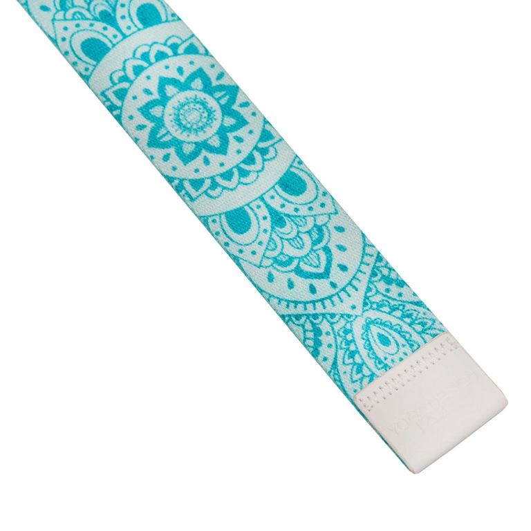 Turquoise mandala-pattern yoga strap on white background.