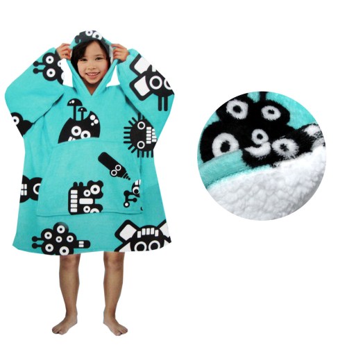 Child wearing blue hooded poncho with black designs.