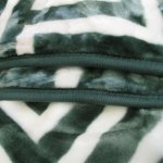 bloomington 800gsm greek key green winter premium quality 1 ply mink blanket double Close-up of green and white fluffy fabric