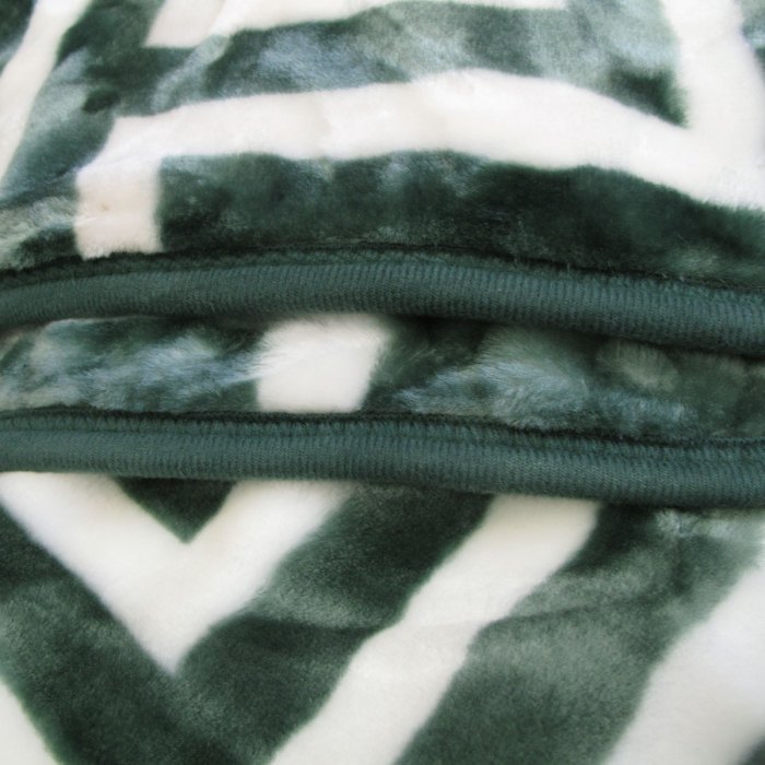 bloomington 800gsm greek key green winter premium quality 1 ply mink blanket double Close-up of green and white fluffy fabric