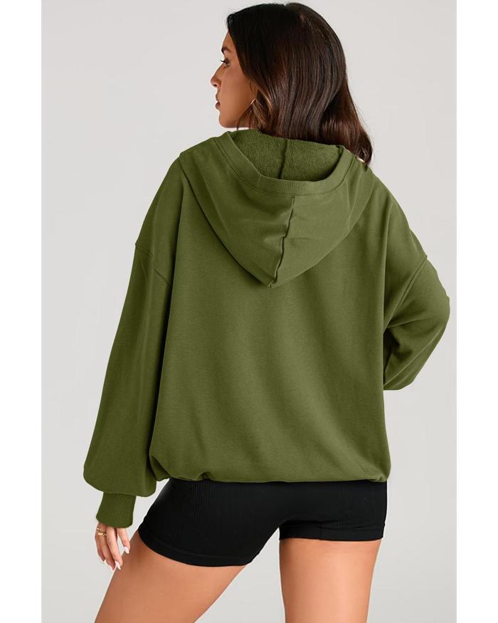 moss green solid kangaroo pocket half zipper oversized hoodie 2xl Woman wearing green oversized hoodie and black shorts.