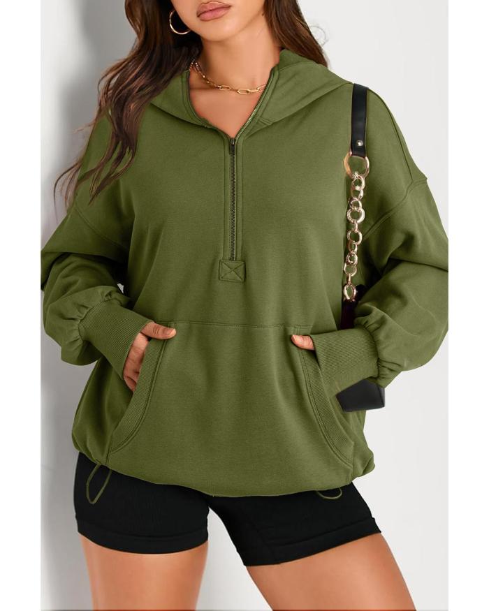 moss green solid kangaroo pocket half zipper oversized hoodie 2xl Woman in green hoodie with black shorts.