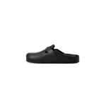 Black ergonomic slip-on clog with strap.