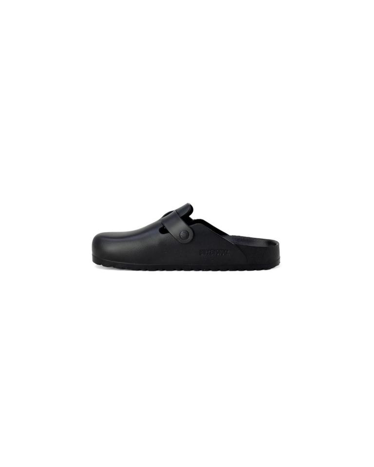 Black ergonomic slip-on clog with strap.