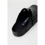 Black Birkenstock clog with buckle detail.