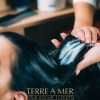 Applying hair treatment at salon for repair.