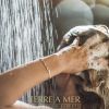 terre a mer pure hydration amino acid/argan oil shampoo & conditioner 60ml travel size Person washing hair under shower, Terre a Mer logo.