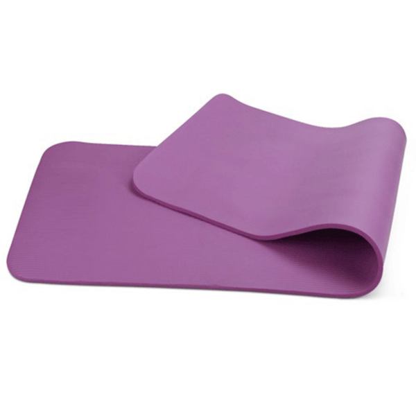 Purple yoga mat on white background.