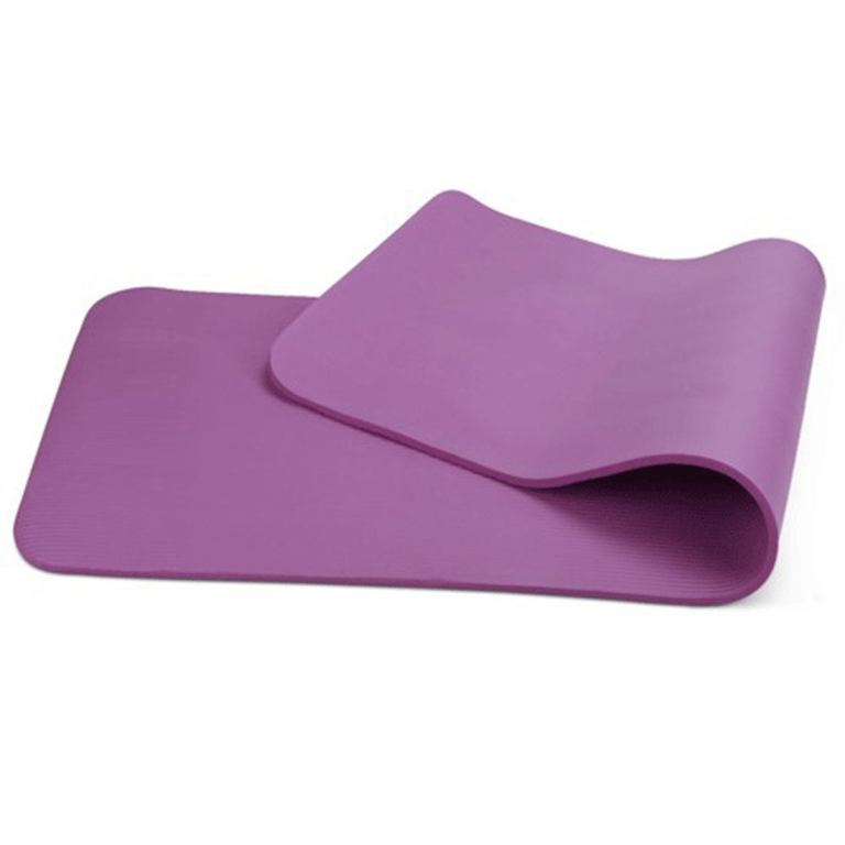 Purple yoga mat on white background.