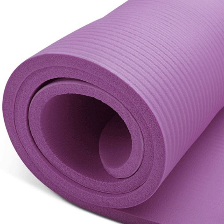 Purple yoga mat rolled up