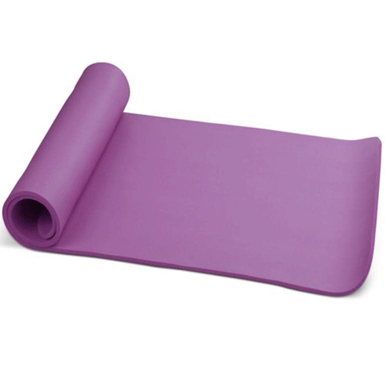 Rolled purple yoga mat on white background.
