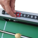 Hand adjusting table tennis score counter.