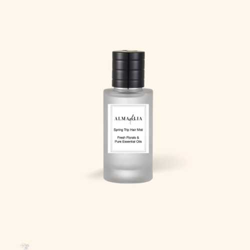 Spring Trip Hair Mist bottle with essential oils.