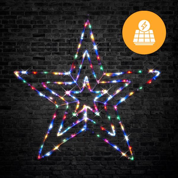 Colourful LED star light on brick wall