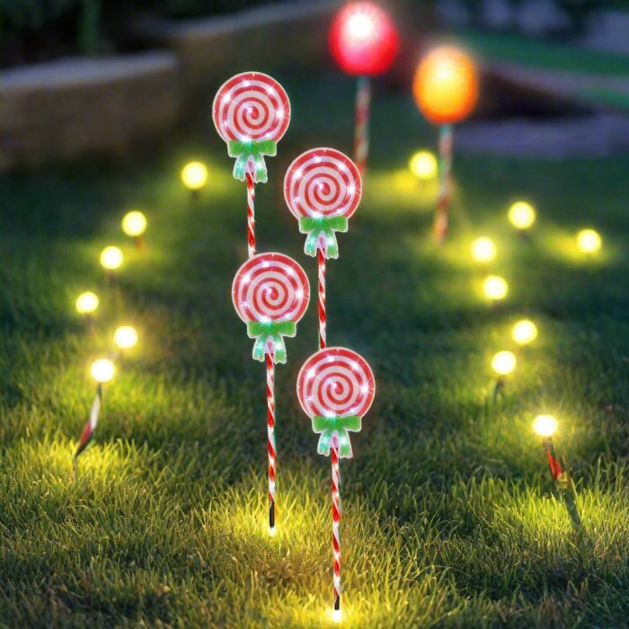 Solar candy cane garden lights glowing at night.