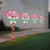 Candy cane garden lights at dusk