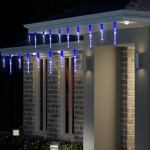 House decorated with blue icicle Christmas lights.