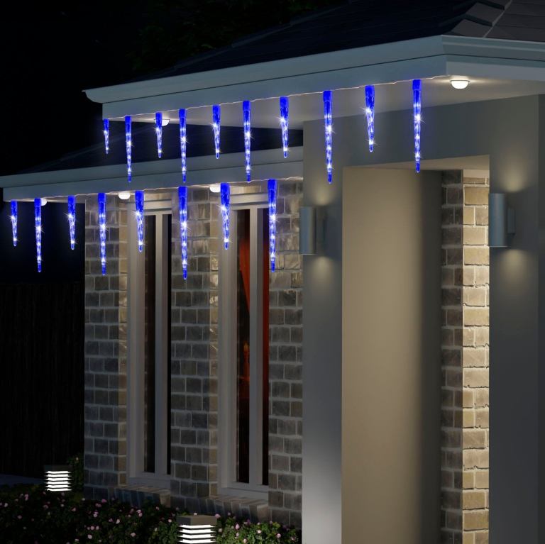 House decorated with blue icicle Christmas lights.