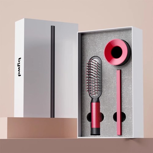 Red hairbrush and accessories in open box