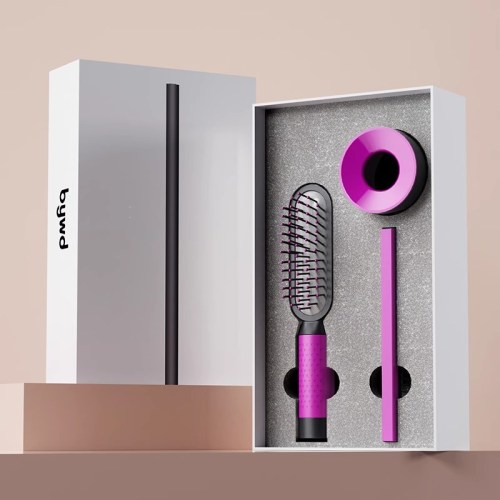 Pink hairbrush set in open box packaging.