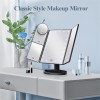 black led lighted tri fold vanity mirror with 2x/3x/10x magnification Tri-fold makeup mirror with LED lights on table.
