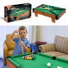 wooden mini snooker tables billiards game pool table set toy extra size for kids Child playing pool on small table in lounge.