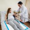 40pk adult disposable bed underpads 60 x 90cm Pregnant woman having blood pressure checked by nurse.