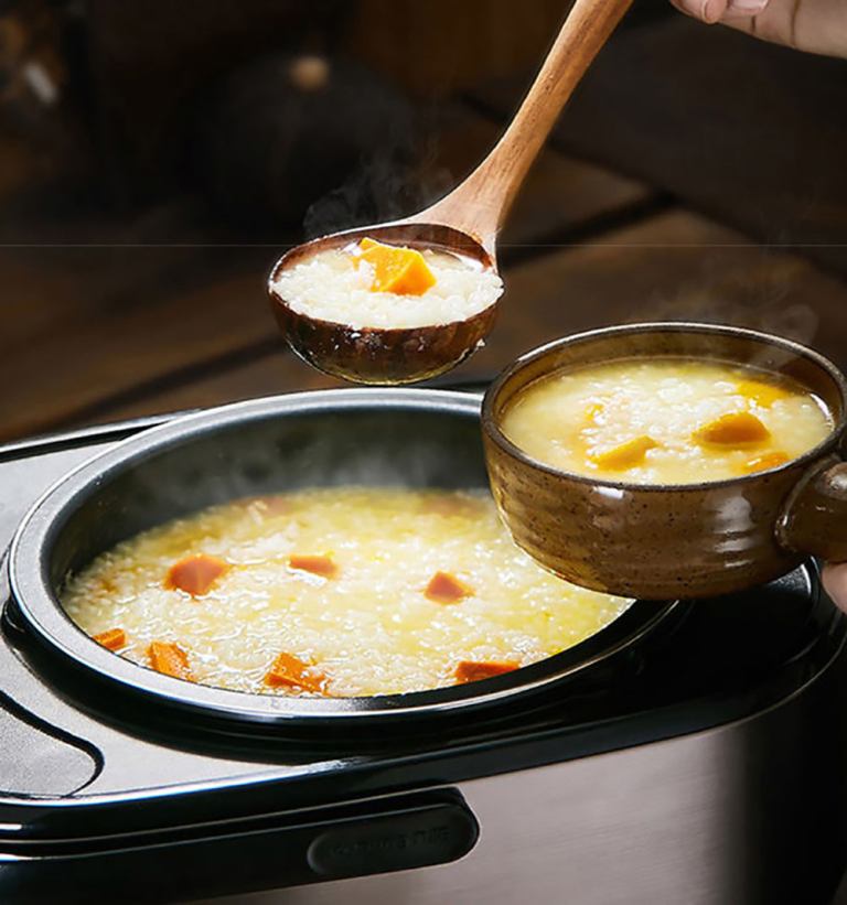 joyoung mini rice cooker 2l for 1 3 people led touch panel fa f20 au model Ladle serving steaming pumpkin soup from slow cooker.
