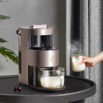 Person serving hot milk with milk frother.