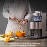 Person using Joyoung soy milk maker in kitchen.