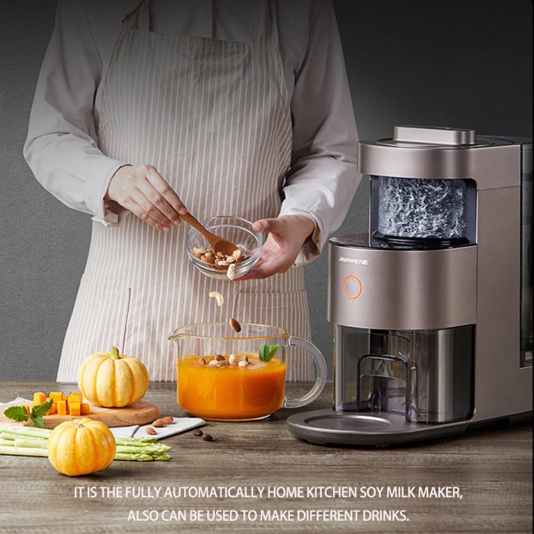 Person using Joyoung soy milk maker in kitchen.