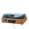 Vintage turntable playing vinyl record with cover closed.