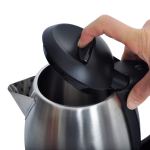 Opening stainless steel kettle lid by hand.