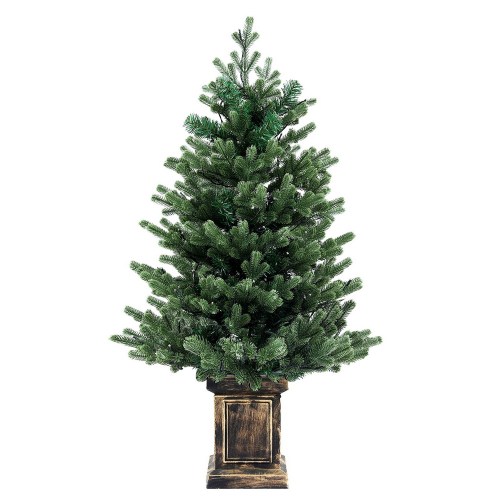 Artificial Christmas tree in wooden planter.