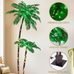 Artificial palm tree with LED lights and metal base.