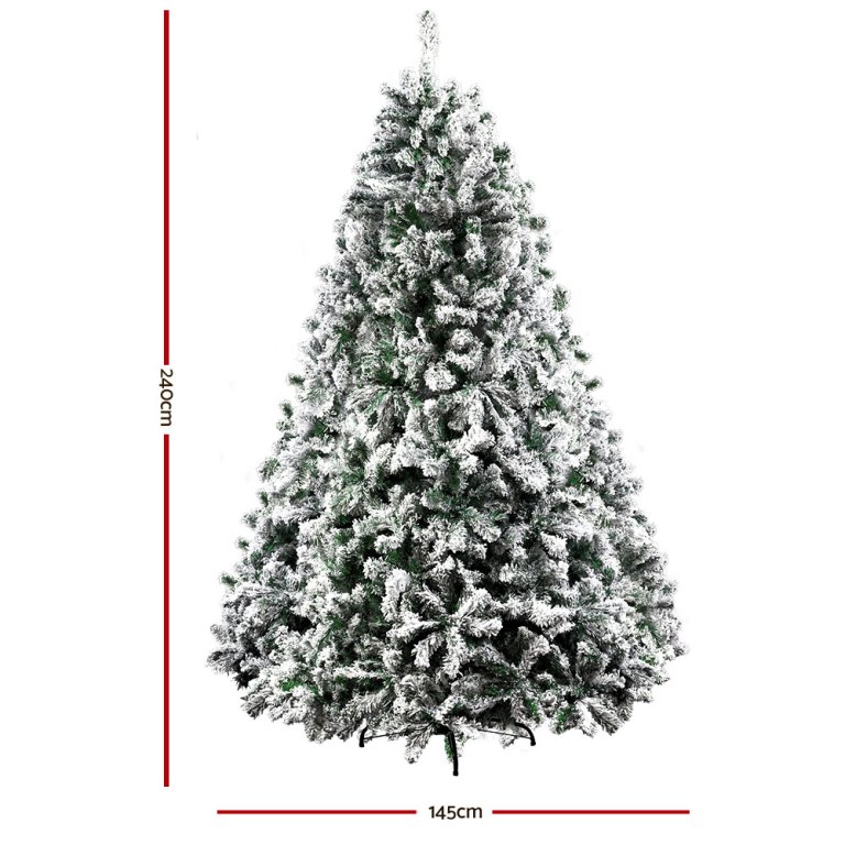 jingle jollys christmas tree 2.4m xmas tree decorations snow flocked 1500 tips Snow-covered green artificial Christmas tree, 240cm tall.