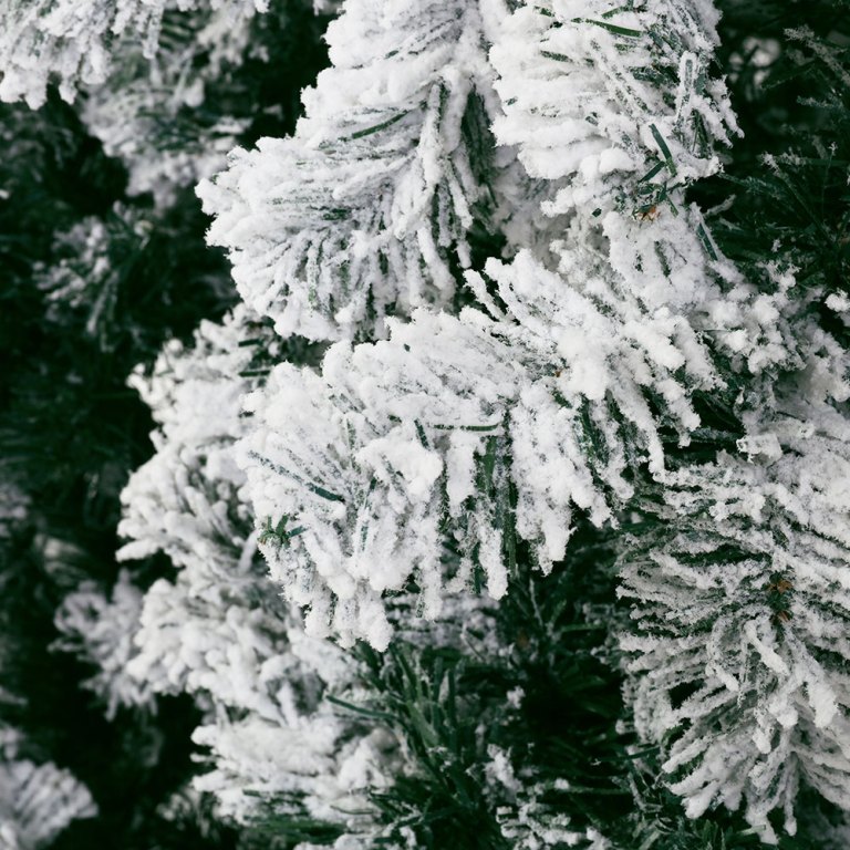 jingle jollys christmas tree 2.4m xmas tree decorations snow flocked 1500 tips Close-up of snow-covered pine tree branches.