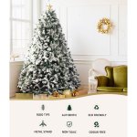 jingle jollys christmas tree 2.4m xmas tree decorations snow flocked 1500 tips Snowy Christmas tree in elegant living room.