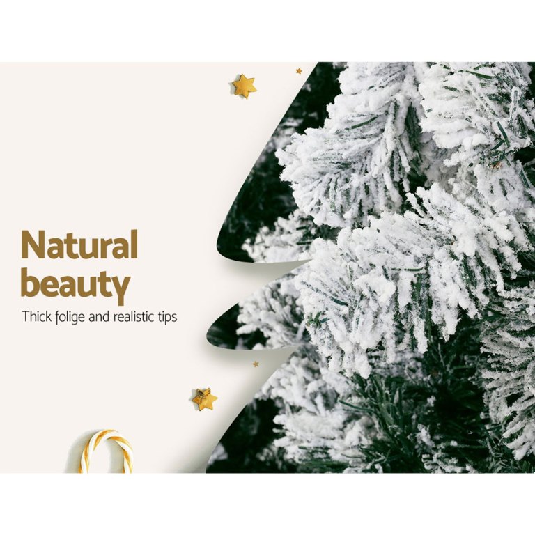 jingle jollys christmas tree 2.4m xmas tree decorations snow flocked 1500 tips Snow-dusted artificial Christmas tree branches.