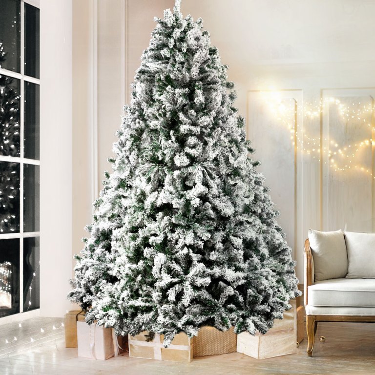 jingle jollys christmas tree 2.4m xmas tree decorations snow flocked 1500 tips Frosted Christmas tree with presents in living room.