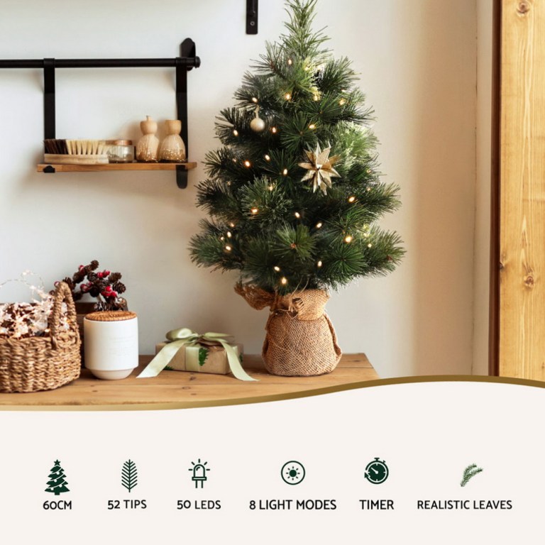 jingle jollys christmas tree 60cm mini tabletop 8 light modes timer xmas tree 60cm decorated Christmas tree with lights on table.