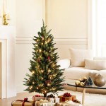 jingle jollys mini christmas tree 90cm led xmas tree party decorations Festive Christmas tree with lights and gifts indoors.