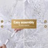 Simple assembly of artificial white Christmas tree.