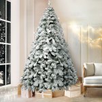 jingle jollys christmas tree 2.1m snow flocked xmas tree decorations 780 tips Snowy Christmas tree in living room with presents.