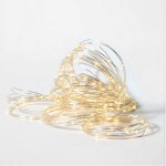 Warm fairy string lights on white background