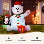 Inflatable Christmas bear and penguin decoration in yard.
