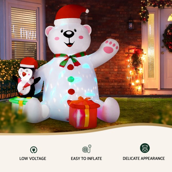 jingle jollys christmas inflatable bear 1.8m height led outdoor decorations illuminated Inflatable Christmas bear and penguin decoration in yard.