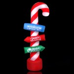 Candy cane pole with North Pole signs.
